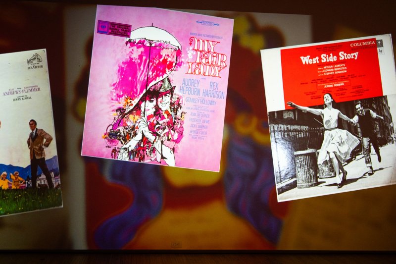 Three vintage musical soundtrack album covers: "My Fair Lady" (pink), "West Side Story" (red/B&W), and "The Sound of Music" (sepia).