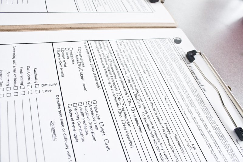 A close-up of a white medical form with black text and checkboxes, titled "The Center for Autosexual Reproduction".