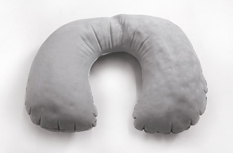 Gray, U-shaped inflatable travel pillow on a white background.