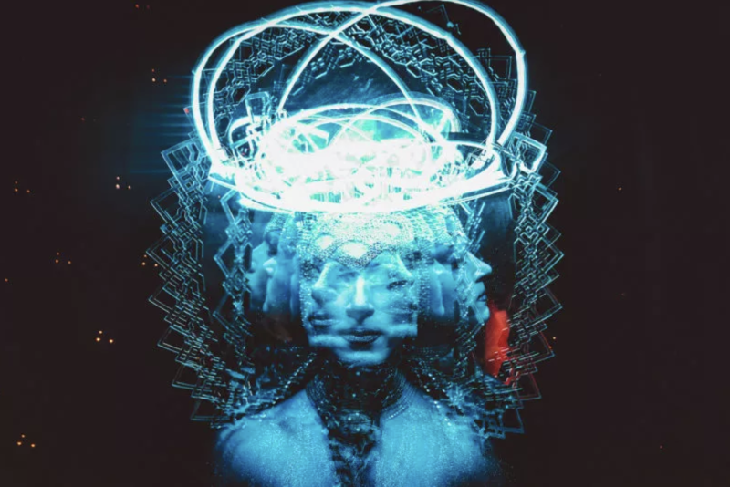 Multiple blue-toned faces in profile and forward-facing, with glowing light and geometric patterns emanating from the head.